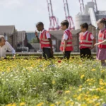 Mayor Steve Rotheram with children at an environmental project.
