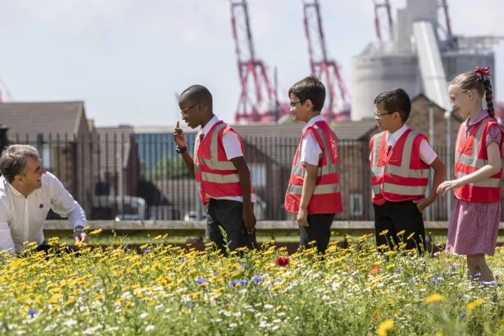 Mayor Steve Rotheram with children at an environmental project.
