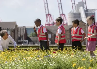 Mayor Steve Rotheram with children at an environmental project.