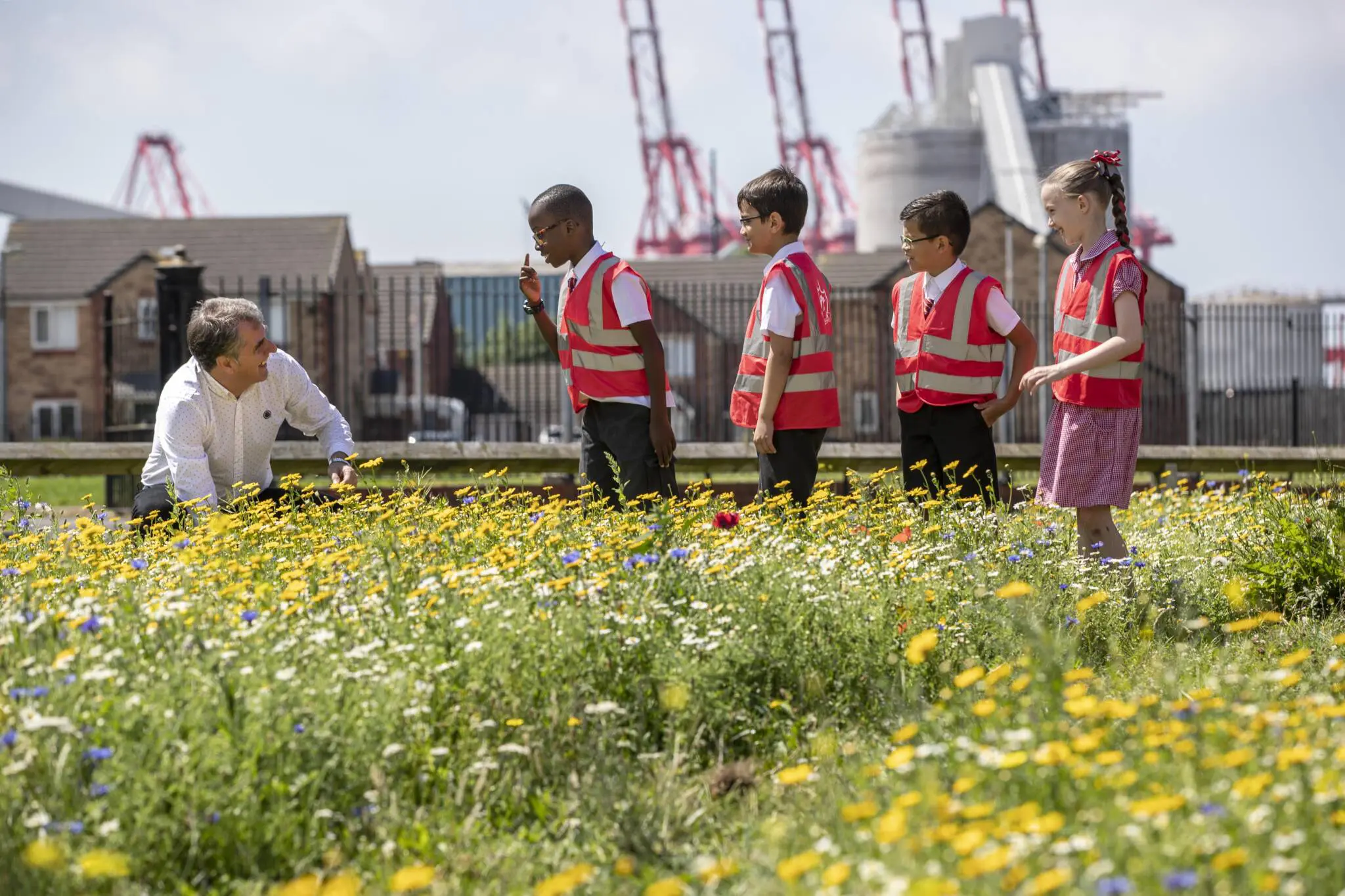 Mayor Steve Rotheram with children at an environmental project.